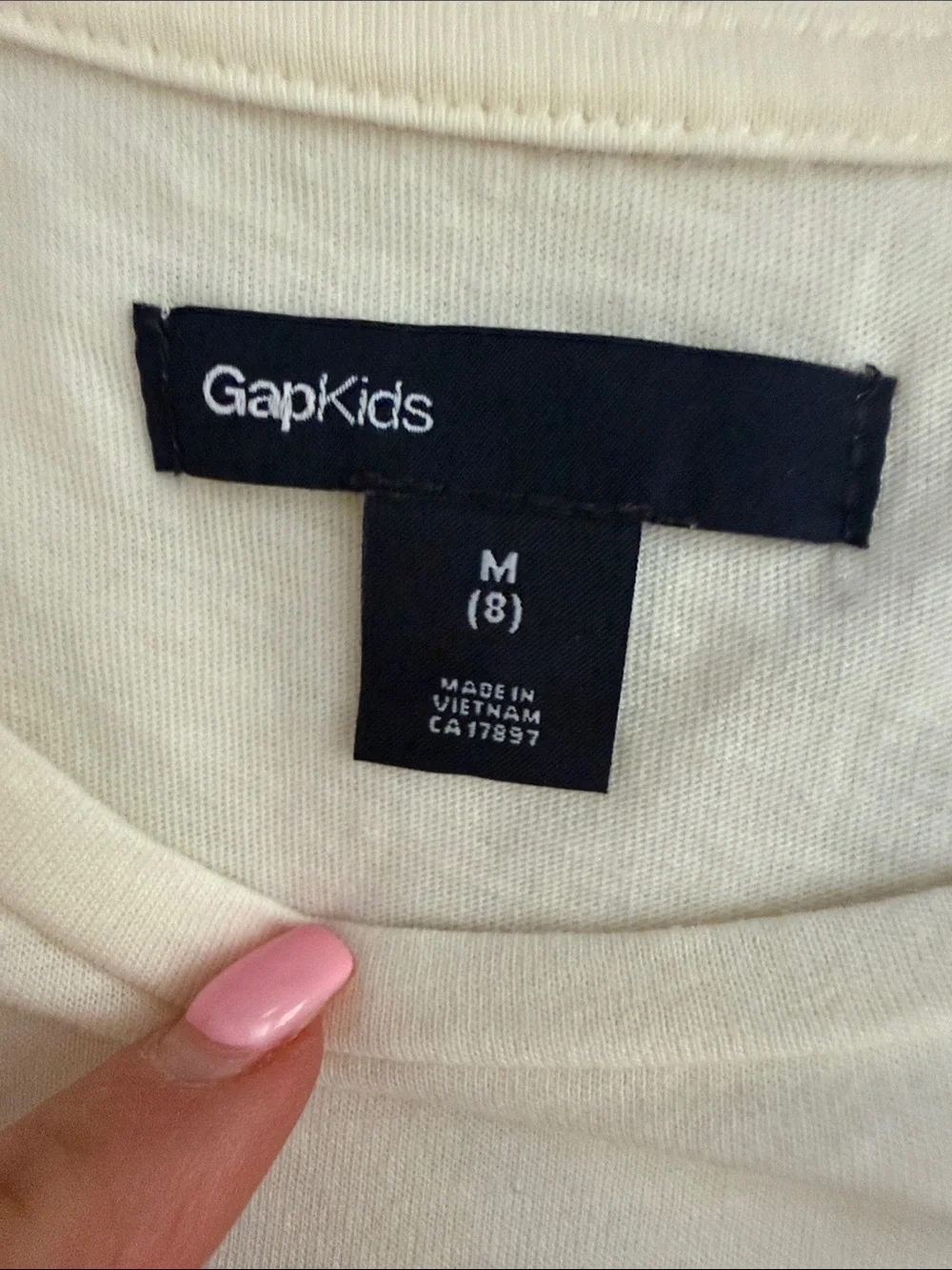 GAP Kids Cream Tee with holiday penguin paired with gold sequin skirt